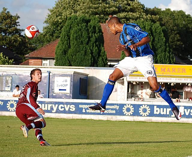 Joe Thompson wins a header.