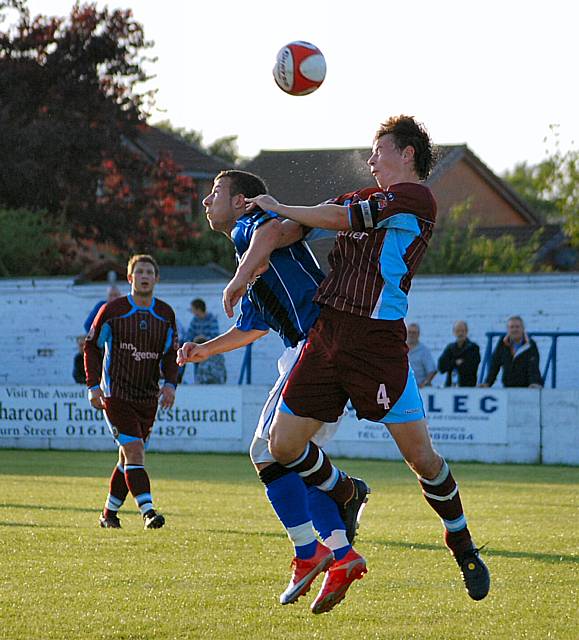 Le Fondre goes up for a header.