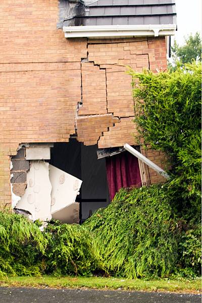 The badly damaged house at 1 Badger Close