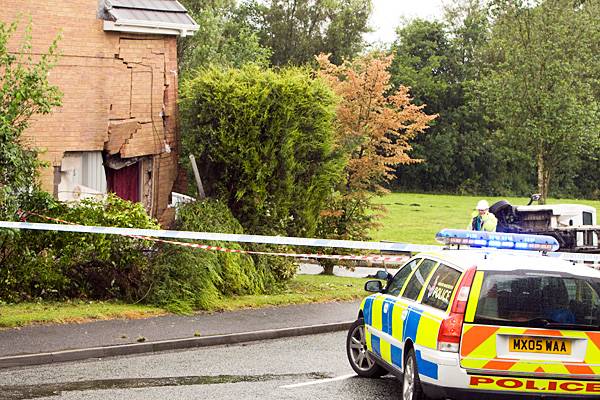 The badly damaged house at 1 Badger Close