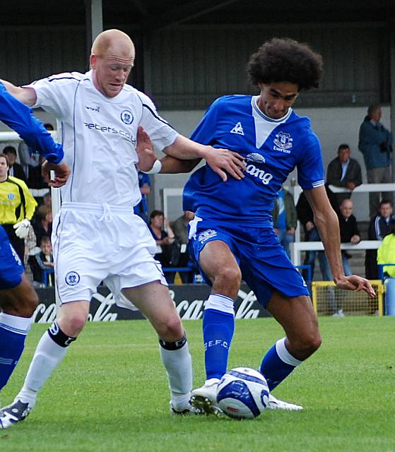 Kennedy battles with Marouane Fellaini.