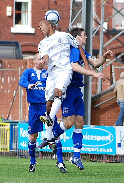 Thompson rises with Baines in the Everton box.