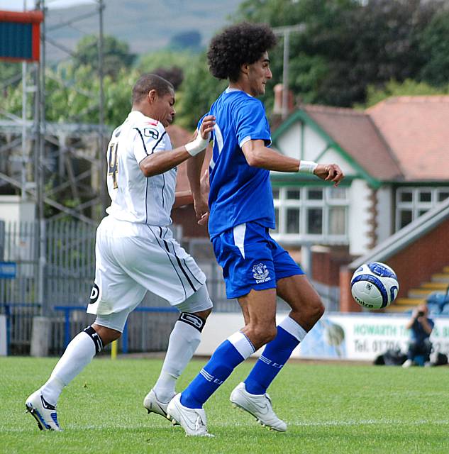 Fellaini gathers possession in front of Nathan Stanton.