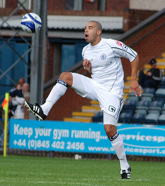 Trialist Marlon Broomes brings the ball down.