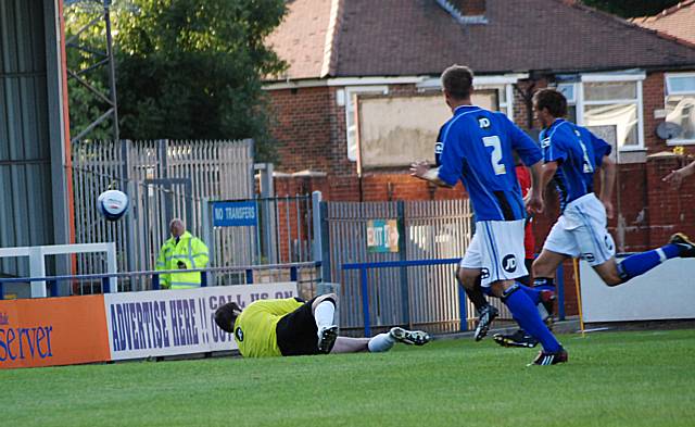 Brandy chips the ball over Arthur to open the scoring.