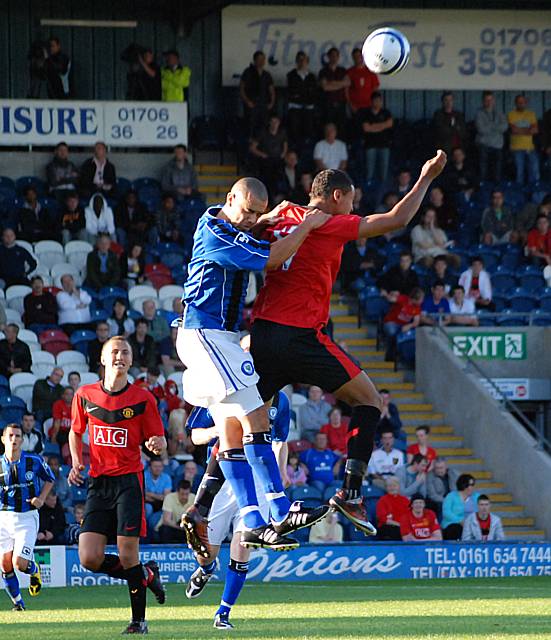 Broomes goes up for a header with Joshua King.