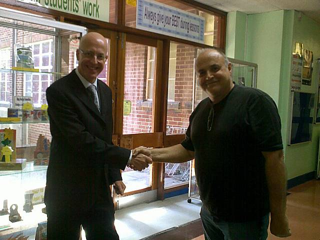 Shaking hands with the Acting Head of Balderstone Technical College