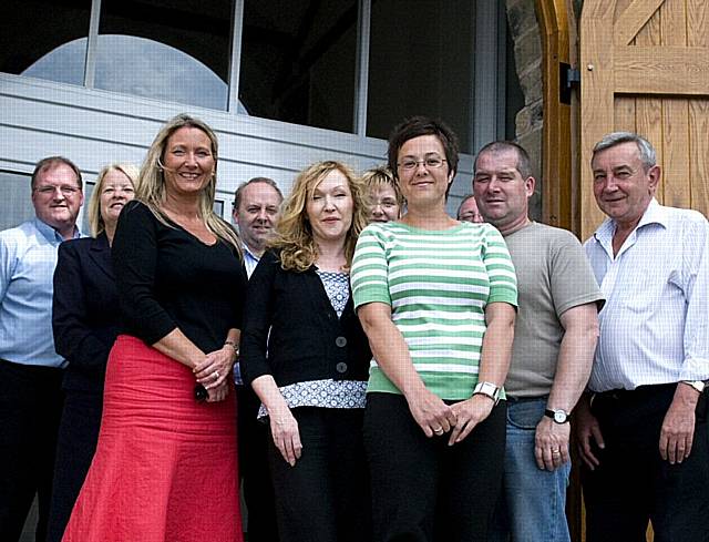 Staff outside the new building at Boarshaw Farm