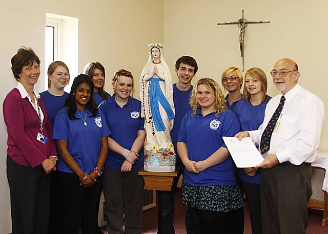 Some of the sixth formers of St Cuthbert's with Mrs Beisty and President John Welsh of the Rochdale Catenians