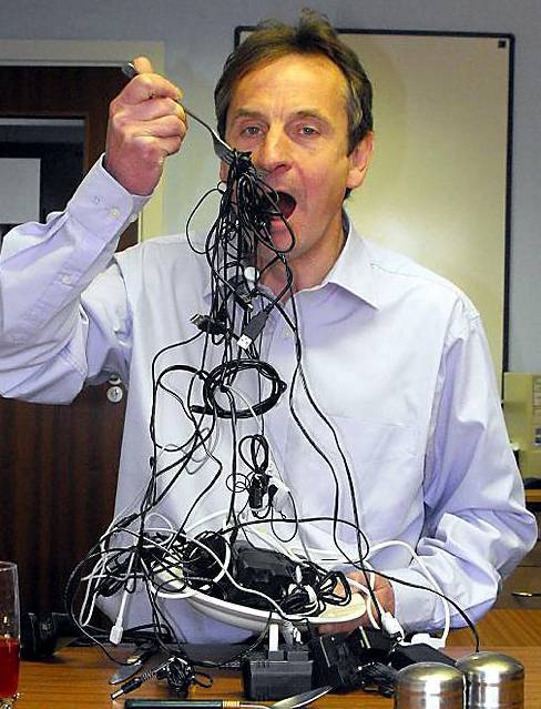 Chris Davies tucking into a plate of wire spaghetti