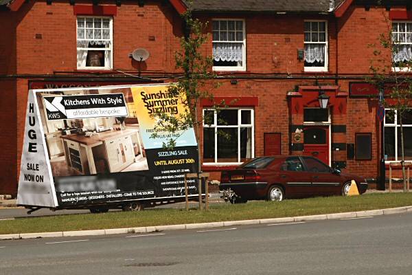 The trailer advert/clamped car outside the Waggon and Horses pub