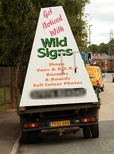 Advert van parked opposite the entrance/exit to Tesco