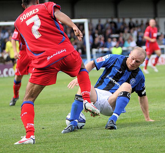 Jones wins the ball from Soares.