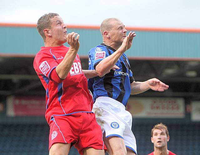 Jones goes up for a header with Chalmers.