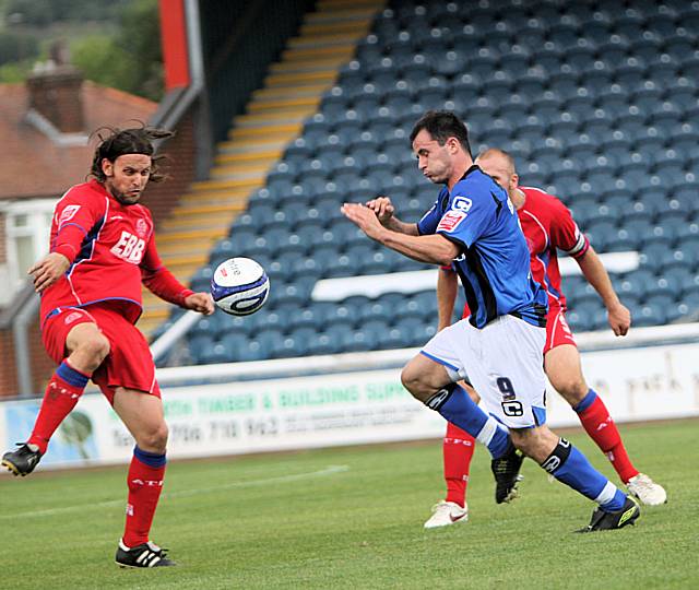 Dagnall starts the late burst that ends in his shot cannoning off an arm in the penalty area.