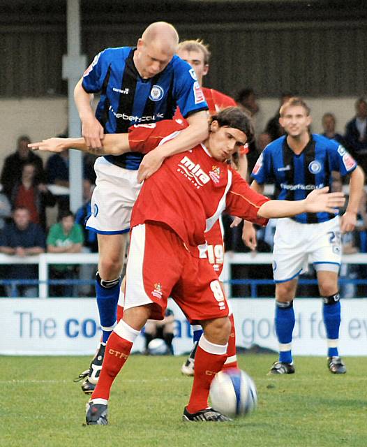 Jason Kennedy challenges with Andy Gallinagh.