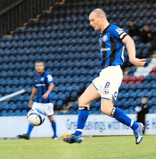 Gary Jones receives possession.