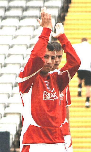 Ex-Rochdale striker Adam Le Fondre applauds the Dale fans.