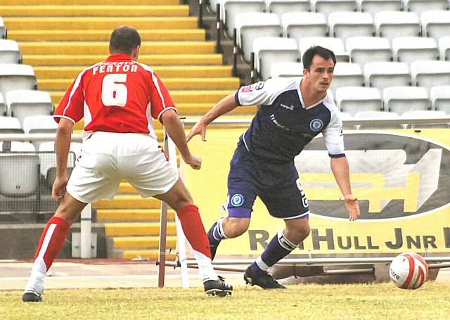 Chris Dagnall cuts inside Nick Fenton.