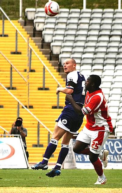 Gary Jones wins a header.