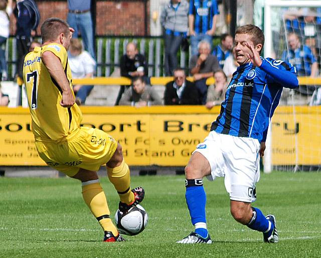 Tom Kennedy goes in for a tackle.