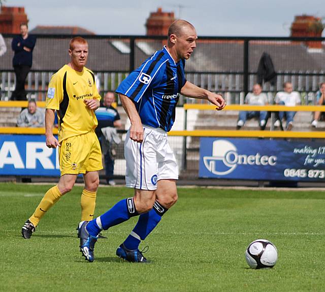 Gary Jones lays the ball off.