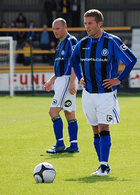 Tom Kennedy lines up the free-kick from which Jones (behind) scores Dale's third.