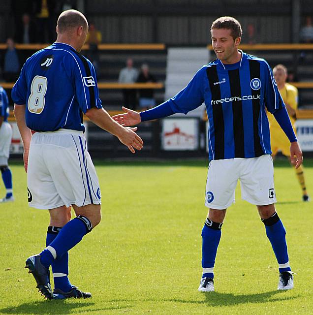 High fives after Kennedy and Jones' free kick routine pays off.