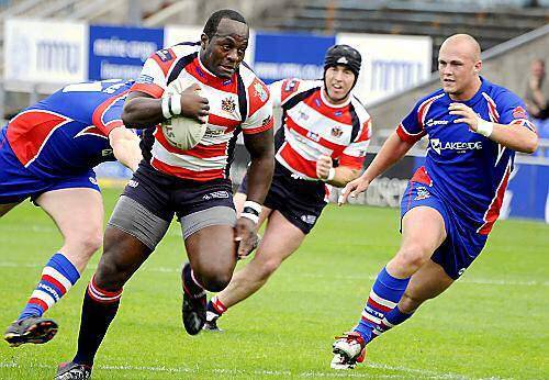 Loose-forward Phil Joseph, who was immense for Oldham, powers his way towards the Hornets line.