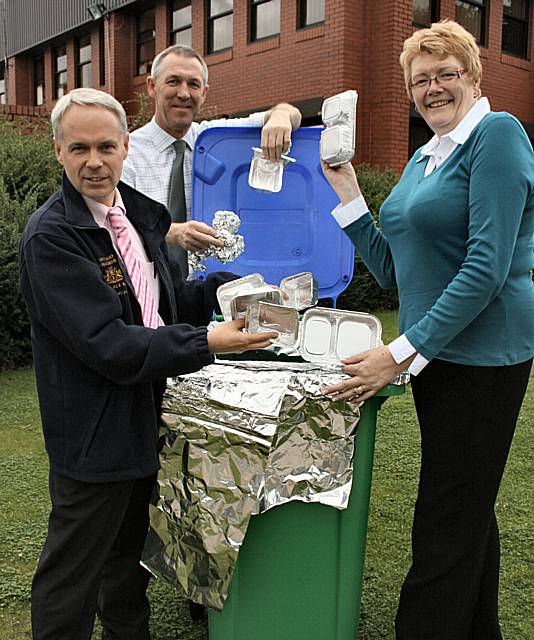 Councillor Irene Davidson recycles tin foil alongside Phil Tomlin (left) and Andy Shaw from the council’s recycling team.