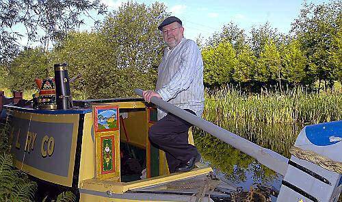 David Heyes MP steers Maria along the Rochdale Canal