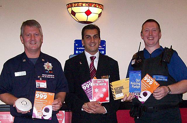 Community Fire Safety Officer Phil Greenwood with Nadim Akhtar from Mecca Bingo and PCSO Alan Hall.