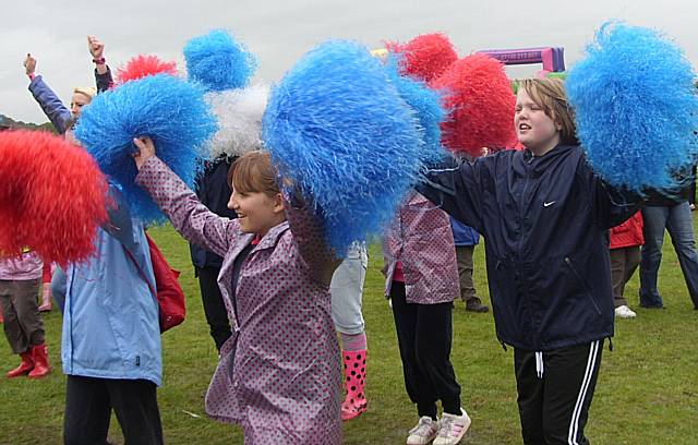 Guides take part in some cheerleading at the centenary event in Heaton Park.