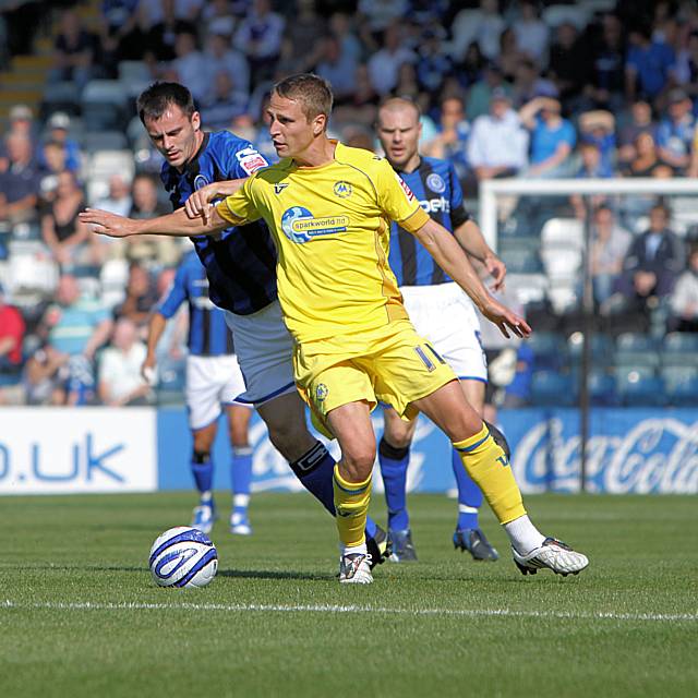 Chris Dagnall pressures Nicky Wroe.