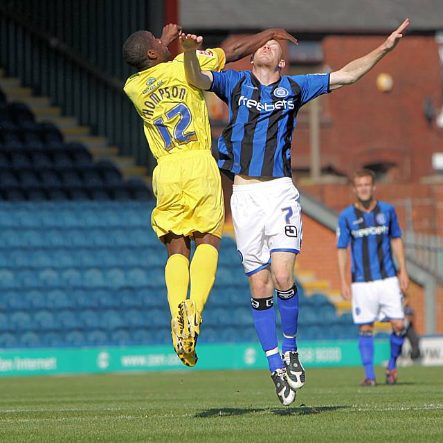 Tyrone Thompson and Jason Kennedy challenge for a header.