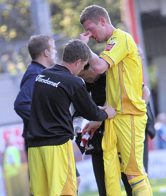 Robertson is forced to leave the field with a bloodied nose.