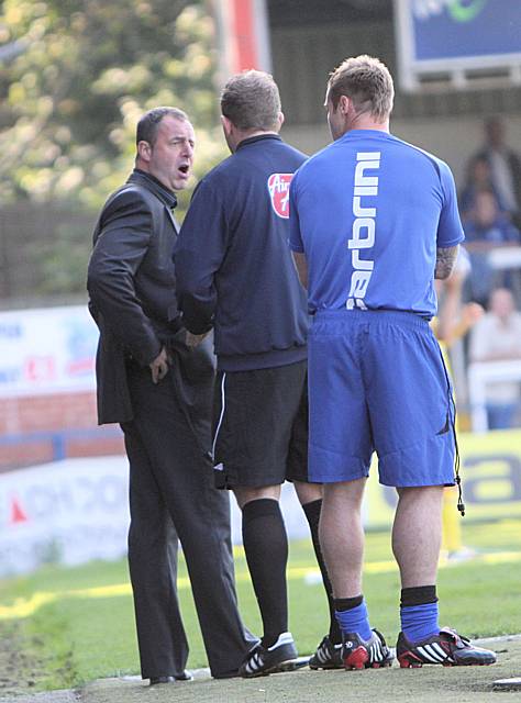 Dale boss Keith Hill has an exchange of views with the fourth official.