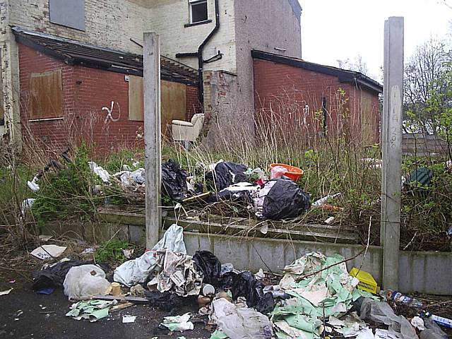 Flytipped rubbish on Sparthbottoms Road.