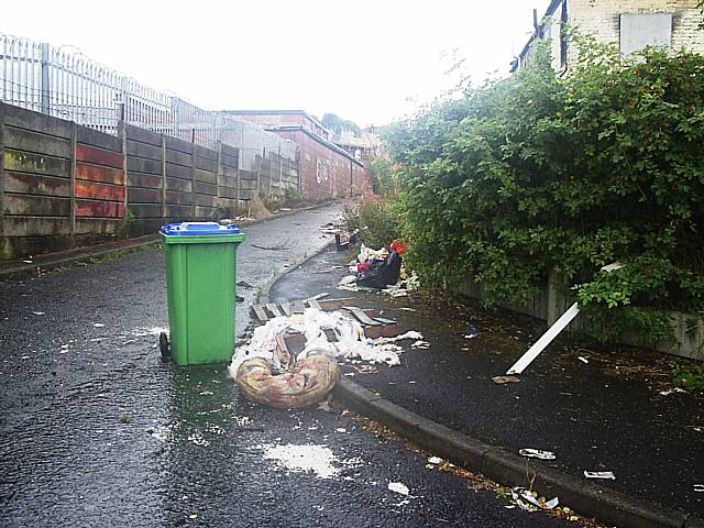 Flytipped rubbish on Sparthbottoms Road