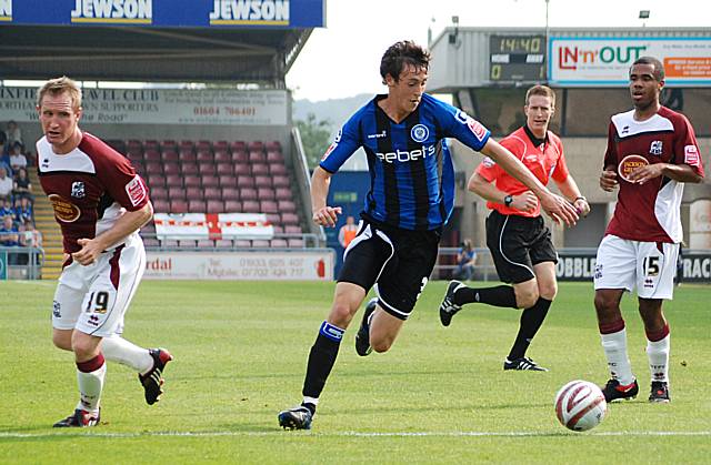 Buckley gets away from two defenders.