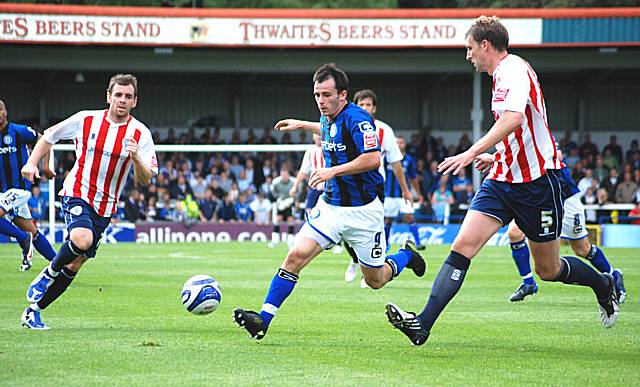 Dagnall again goes at the Bury defence.