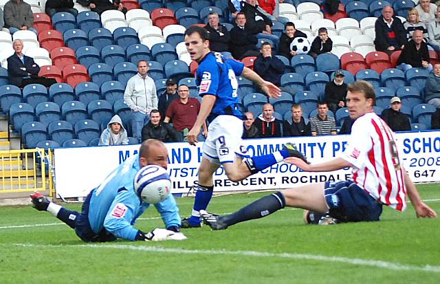 Dagnall beats Wayne Brown with a shot but the ball goes the wrong side of the post for the Dale striker.