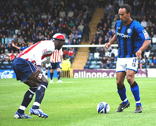 Chris O'Grady takes on Sodje.