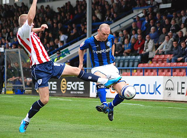 Dawson tackles Gary Jones.