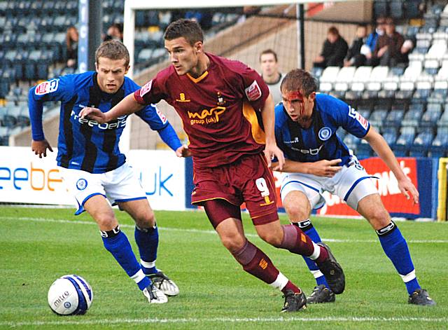 Gareth Evans keeps the ball away from Tom Kennedy and Craig Dawson.