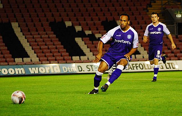 Chris O'Grady lays the ball off.