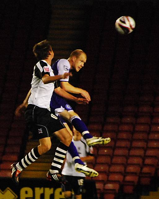 Jason Kennedy rises for a header.