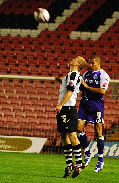 Nathan Stanton challenges Curtis Main for a header.