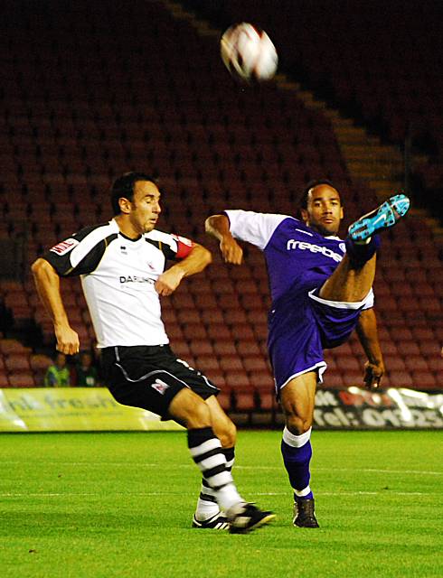 O'Grady hooks the ball forward.