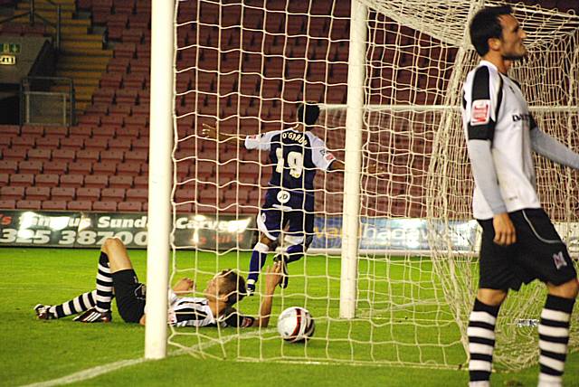 O'Grady wheels away as Darlington defenders despair.